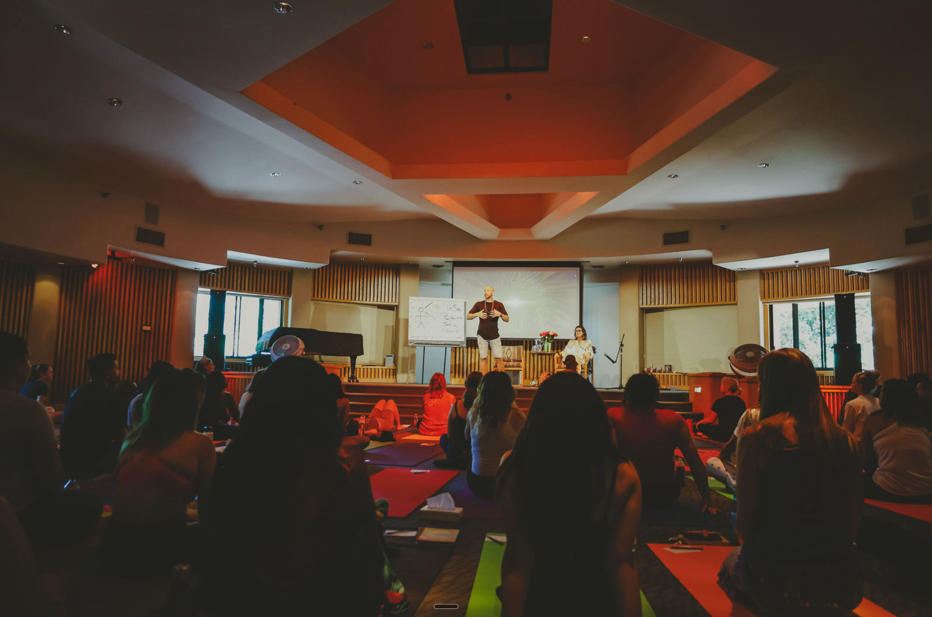 Breathwork release on stage during day 2